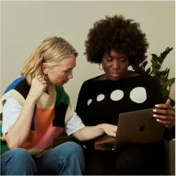 Product designer receiving detailed portfolio feedback during Practice Round review session